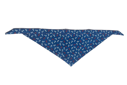 Dog bandana with pattern of red and white anchors on blue background