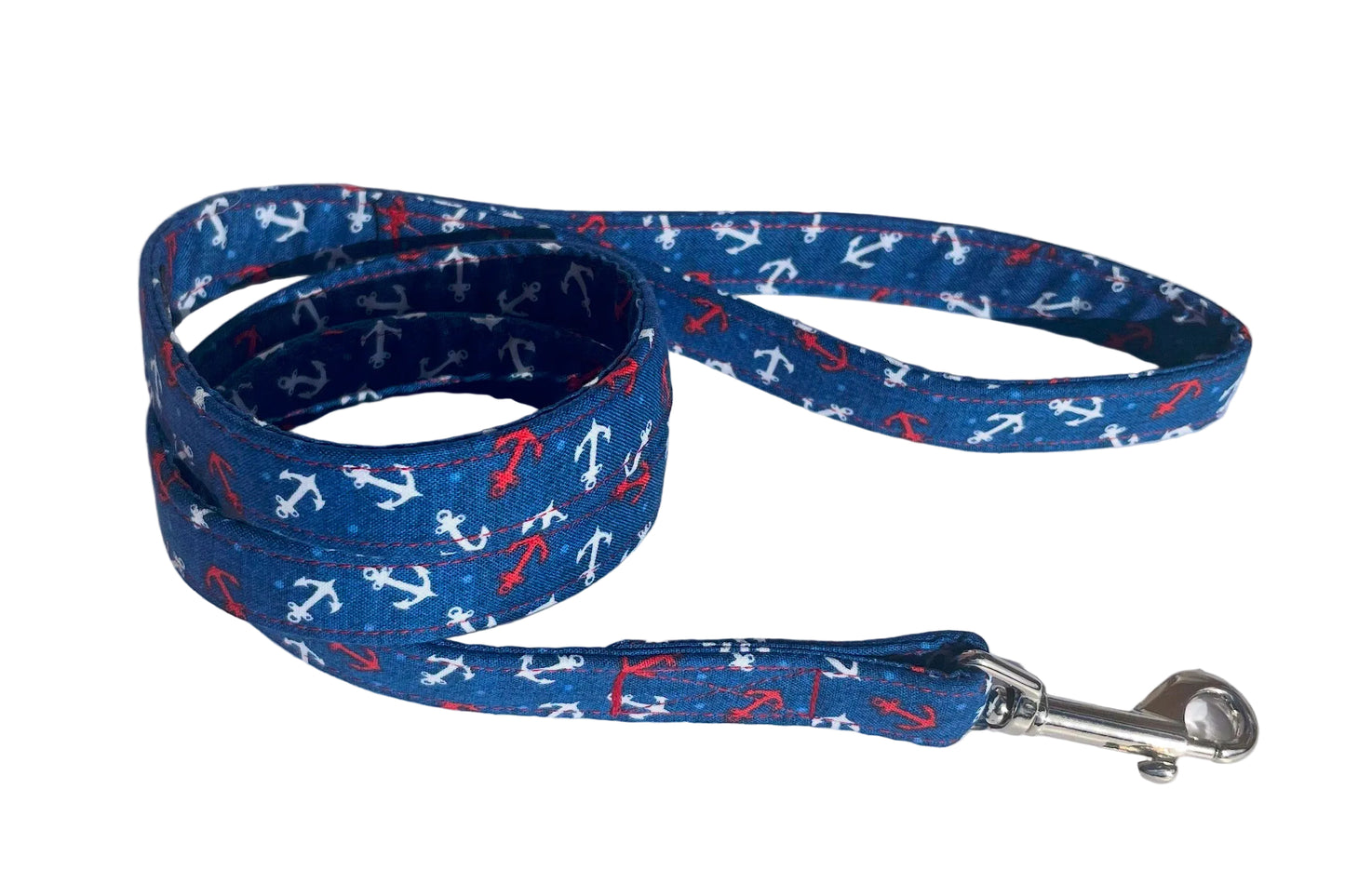Handmade dog lead with pattern of red and white anchors on navy blue background - the Lundy design by BlossomCo