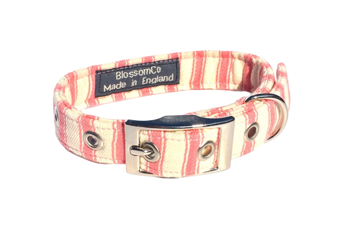 A pastel pink and creamy white striped dog collar with a metal buckle, handmade by BlossomCo.